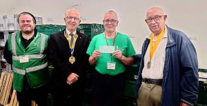 Nuneaton Food Bank with Richard Talbot and Paul Marsh of Arbury Rotary handing a cheque of support to Richard Fleming and Jim Keeley
